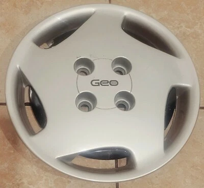 (1) Cubierta de rueda tapacubos atornillable Geo Prizm LSi 1991 fabricante original raro #0A p/n 10150809 Foto 1 de 4