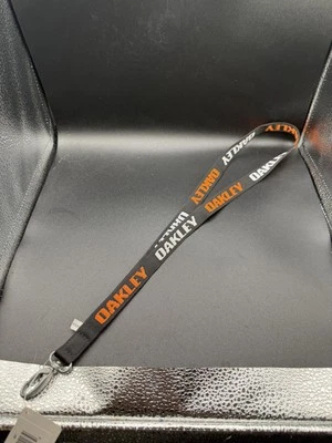 Cordón Oakley Standard gris/naranja Foto 1 de 2