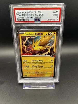 2025 POKEMON DESTINED RIVALS GAMESTOP EXCLUSIVE #070 TEAM ROCKET'S ZAPDOS PSA 9 - Image 1 of 2