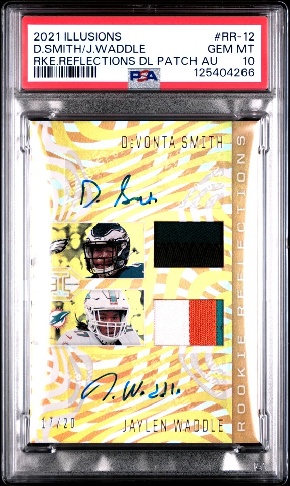 2021 PANINI ILLUSIONS DUAL PATCH AUTO DEVONTA SMITH/JAYLEN WADDLE RC /20 PSA 10 - Image 1 of 2