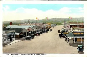 TIJUANA, MEXICO - BUSY MAIN STREET - MINT BAR - OLD POSTCARD - Picture 1 of 2