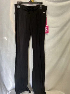 Pantalones acampanados WB negros marca Justice para niñas material elástico talla L 12-14 Foto 1 de 4