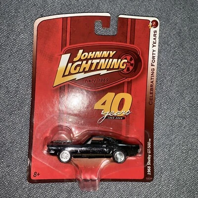 1/64 JOHNNY LIGHTNING 40 YEARS 1968 FORD MUSTANG SHELBY GT-500 BLACK & GOLD - Image 1 of 2