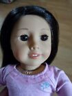 American girl doll - black hair, brown eyes - assortment of clothes included 