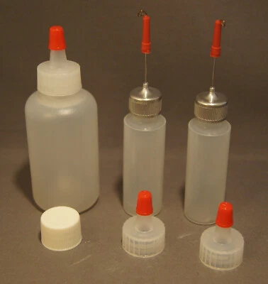 TRES BOTELLAS EXPRIMIBLES DE PLÁSTICO Foto 1 de 4