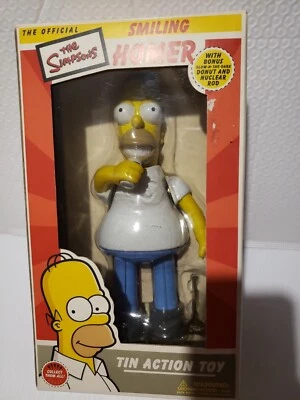 Los Simpson - Juguete de acción de cuerda de hojalata Homero sonriente con donut que brilla en la oscuridad Foto 1 de 4
