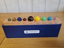 9 GEMSTONES REPRESENTING THE PLANETS ON A WOODEN STAND
