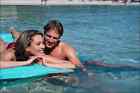 784016 Couple On Inflatable Mattress In Sea A4 Photo Print