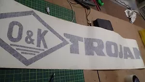 AUFKLEBER LOGO " O&K TROJAN " 10460886400 LL5-9. N.O.S. - Bild 1 von 6