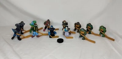 Figuras de hockey TMNT Remco - Juego completo de 12 con disco vintage - Excelente estado Foto 1 de 3