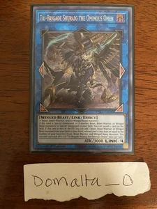 Yugioh Tri-Brigade Shuraig das Ominous Omen PHRA-DE048 1.Auflage Secret Rare NM/VLP - Bild 1 von 1