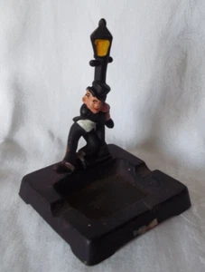 Vintage Antique Cast Iron Ashtray Man Holding onto Light pole 4.5" x 3.25 " - Picture 1 of 5