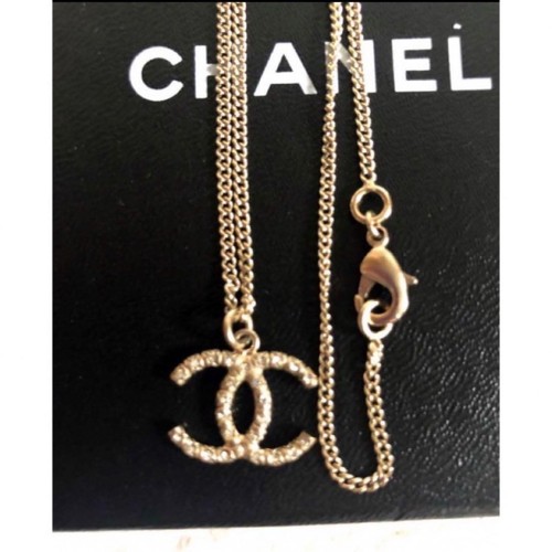 Collana CHANEL marchio cocco strass oro argento