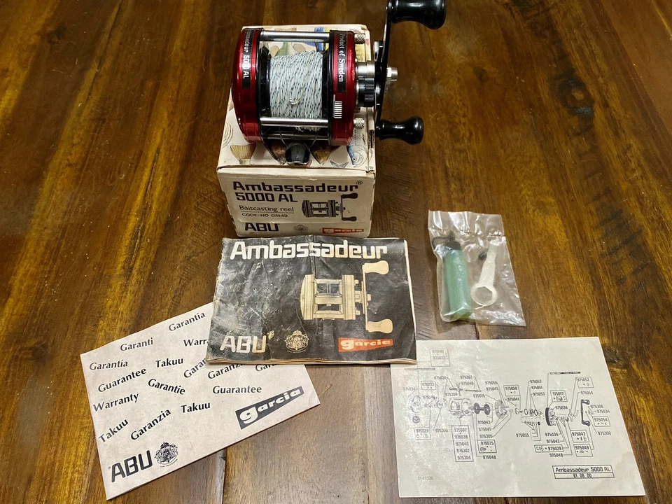 De colección Abu Garcia Ambassadeur 5000 AL 07449 Caja Original Papeles Herramienta y Lubricante  Foto 1 de 4