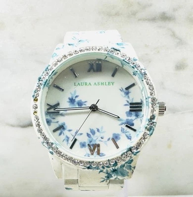 Reloj de cuarzo para dama Laura Ashley esfera floral bisel de cristal correa tono plata Foto 1 de 4