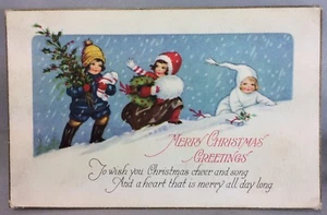 Tarjeta postal antigua original c. 1910 Feliz Navidad saludos niños nieve  - Imagen 1 de 2