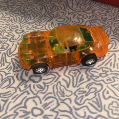 Coche slot Tyco Porsche Carrera escala HO en naranja transparente Foto 1 de 4