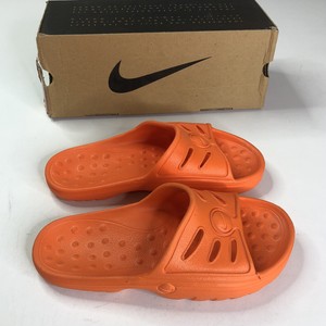 orange nike benassi slides