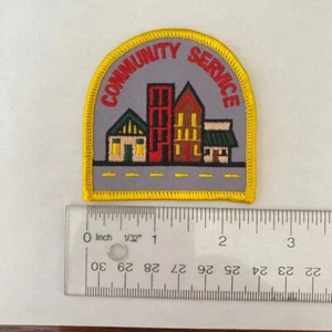 Cub Scout Boy Scout patch yellow border four buildings road - Picture 1 of 2