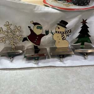 Set Of 4 Enamel & Chrome Stocking Holders Holiday Santa Snowman Snowflake Tree - Picture 1 of 10