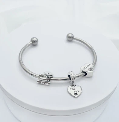 Linx Stainless Steel Bangle with Niece Class Of 2025 Graduation Charms - Image 1 of 4
