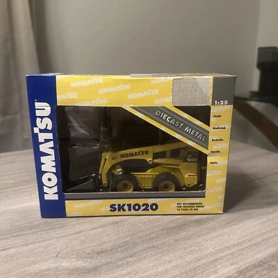 NIB komatsu sk1020 first gear 1:25 Skidsteer Loader Diecast - Image 1 of 4