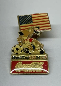 ⚽️ Vintage1994 FIFA World Cup USA Coca Cola Stryker Mascot Holding Flag Pin - Picture 1 of 2