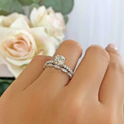 Juego de anillos de compromiso simulados de zafiro blanco corte redondo de 2 quilates en plata 935 Foto 1 de 4