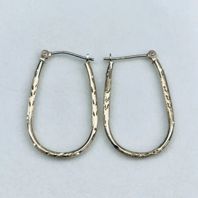 10k Yellow Gold Diamond Cut Oval Hoop Earrings - Image 1 of 4
