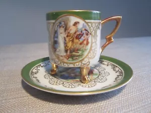 Mitterteich Footed Demitasse Cup Saucer Set Pastoral Couple Cupid Gold Gilt - Bild 1 von 7