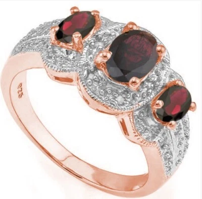 Anillo granate y diamantes para mujer Foto 1 de 4