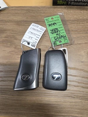 Lot of 2 Used Lexus Smart Keys.  Keys are cut. - Image 1 of 2