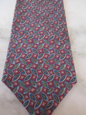 Corbata para el cuello Saddlebred una nueva raza marca - Tono de fondo rojo semillas formas ovaladas Foto 1 de 2