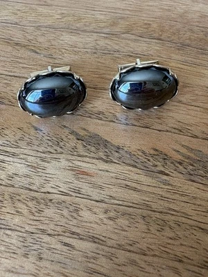 Gemelos de cabujón hematita con forma ovalada de colección borde dorado Foto 1 de 4