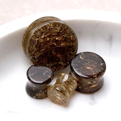 PAIR of Golden Black Smooth Shattered Glass Saddle Plug - Image 1 of 4