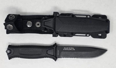 Cuchillo dentado de caza de camping hoja fija negra Foto 1 de 4