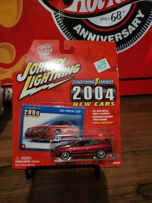 2004 PONTIAC GTO          2004 JOHNNY LIGHTNING LIGHTNING STRIKE NEW CARS   1:64 - Image 1 of 3