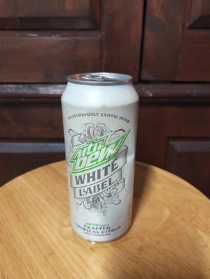 Lata vacía Mountain Dew White Label buen estado 16 OZ Foto 1 de 3