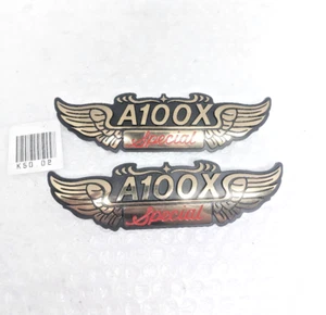 Suzuki A100 AX100 A100X Side Cover Emblem NOS - Picture 1 of 5