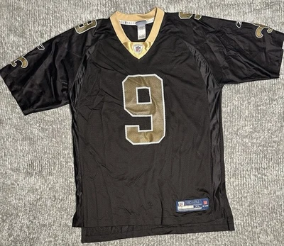 Camiseta deportiva auténtica Reebok Drew Brees Saints On Field talla XL negra dorada para hombre Foto 1 de 4