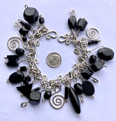 PULSERA ARTESANAL CON CUENTAS DE PIEDRAS PRECIOSAS DE ÓNIX NEGRO Y PLATA ESTERLINA Foto 1 de 2