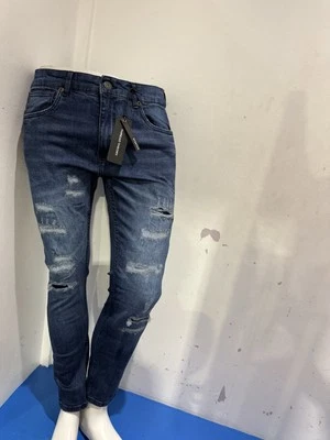 Pantalones de mezclilla ajustados Thread Theory color azul Rip & Repair Foto 1 de 4