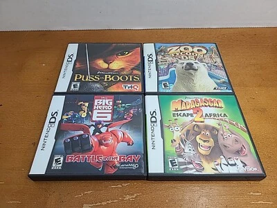 NintendoDS Lot of 4 Games Zoo Tycoon Madagascar Big Hero Puss In Boots Complete  - Image 1 of 4
