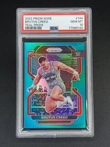 2022 Panini Prizm WWE #144 BRUTUS CREED RC Teal Refractor 17/49 PSA 10 GEM Pop 1 - Picture 1 of 2