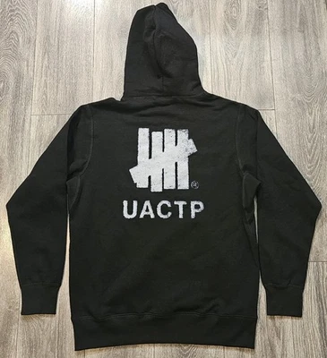 Sudadera con Capucha Undefeated UACTP Negra Espalda Logo Gráfico Para Hombre Talla Mediana Nueva con Etiquetas Foto 1 de 4