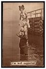 I&#39;M WELL SUPPORTED POSTCARD 1910 WOMAN ON MAN&#39;S SHOULDERS IMAGE SWIMSUITS