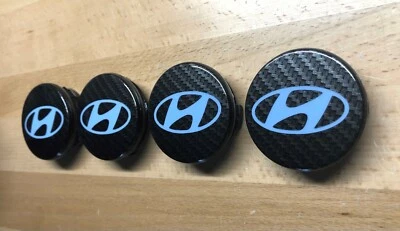Juego de tapacubos centrales de rueda de carbono azul claro OEM Hyundai Elantra N x4 52960-38300 60 mm Foto 1 de 4