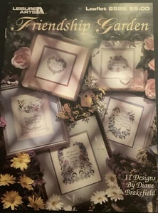 Leisure Arts Friendship Garden 11 Cross Stitch Patterns #2595 flowers butterfly - Picture 1 of 5