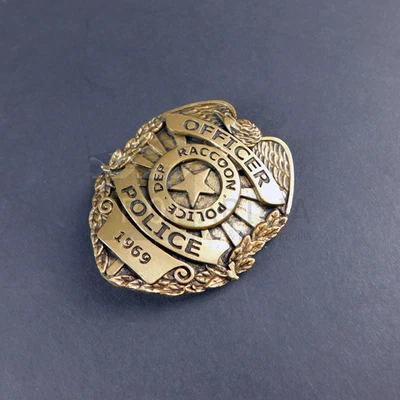 RESIDENT EVIL WELCOME TO RACCOON CITY Raccoon Badge Original Prop (0015-6034) - Image 1 of 4