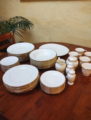 RC by Noritake, 53 piece dinnerware set, excellent cond pattern #111: gold rim - image 1 of 4